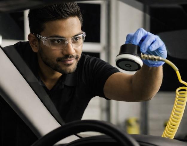 Technician repairing windshield